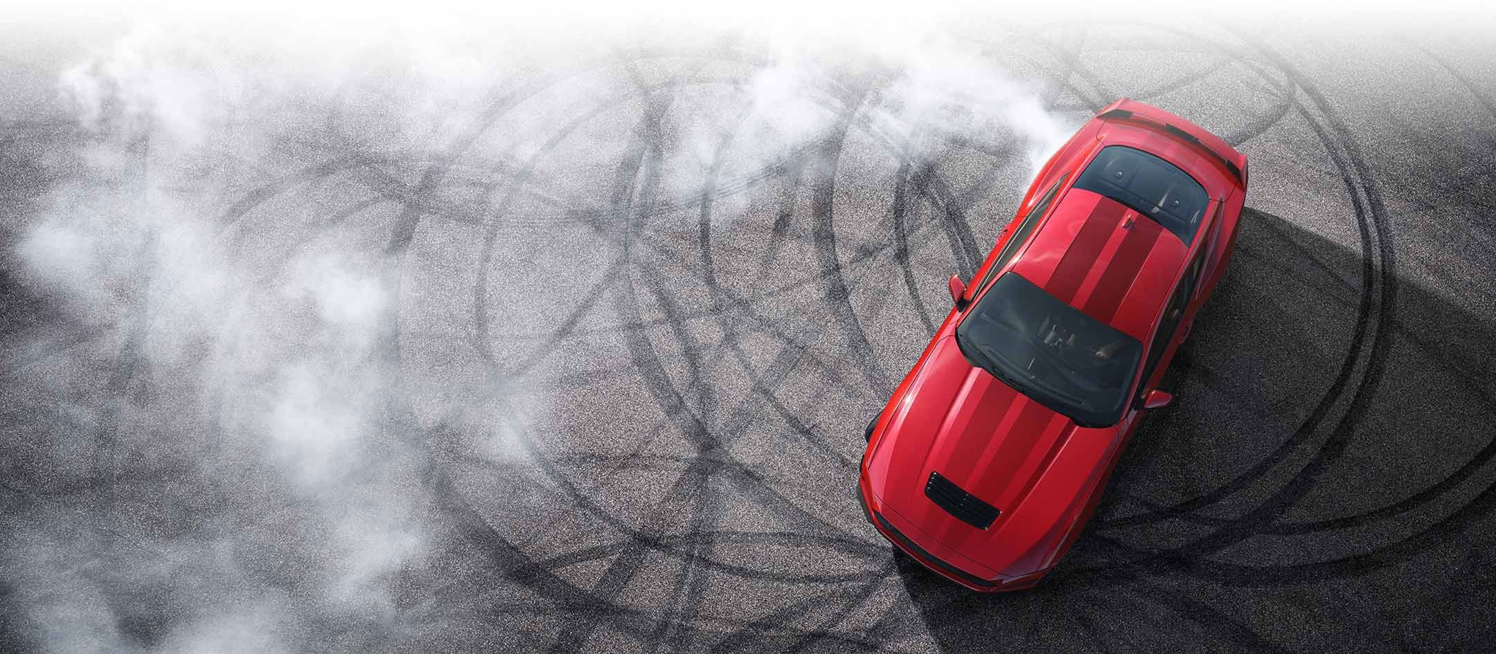 Overhead view of a 2024 Ford Mustang® model with tire tracks on pavement | Cecil Atkission Ford Hondo in Hondo TX