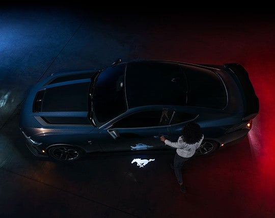 2024 Ford Mustang® Dark Horse™ model with a driver approaching the vehicle | Cecil Atkission Ford Hondo in Hondo TX