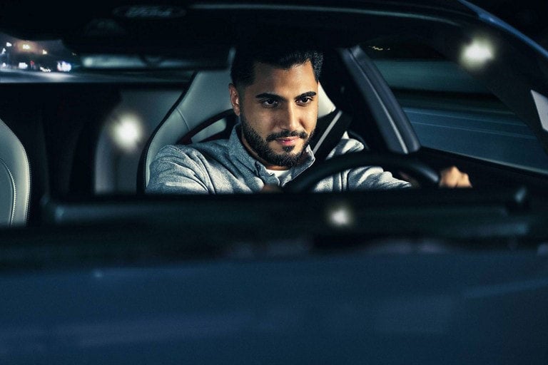 Person sitting in the driver’s seat of a parked 2024 Ford Mustang® coupe | Cecil Atkission Ford Hondo in Hondo TX